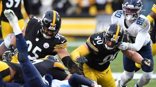 Watt dives to recover a Tennesse Titans fumble Watt dives to recover a Tennesse Titans fumble