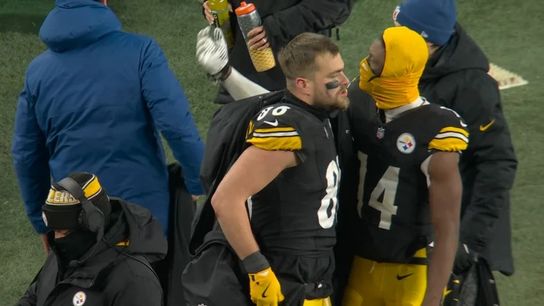 Steelers' Pat Freiermuth has to hold back George Pickens from talking back to fans. Steelers' George Pickens and Pat Freiermuth
