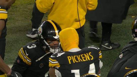 Steelers' Russell Wilson talks to George Pickens on the sideline. Steelers' Russell Wilson and George Pickens
