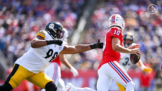 Steelers' Derrick Harmon goes after New England Patriots' quarterback Drake Maye
