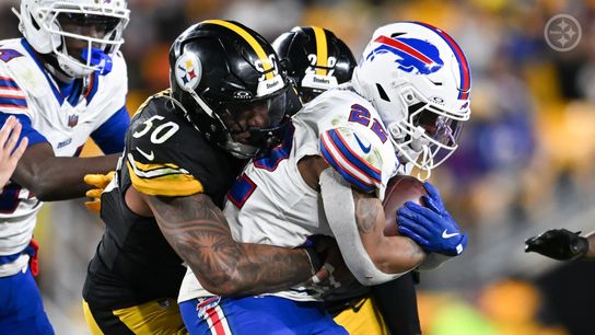 Steelers lineback Malik Harrison tackles Bills running back Ray Davis during Pittsburgh's 26-7 loss in Week 13 of the 2025 NFL Regular Season.