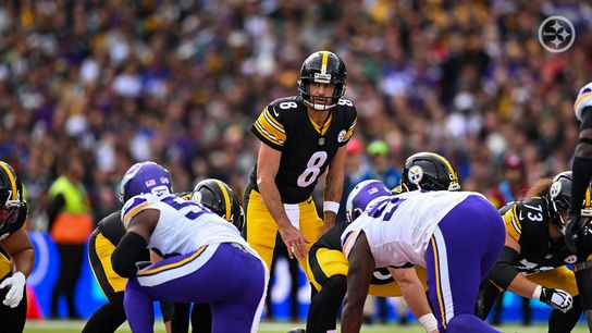 Aaron Rodgers prepares to take the snap against the Minnesota Vikings at Croke Park in Dublin, Ireland
