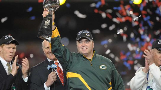 Mike McCarthy Holds the Lombardi Trophy From Super XLV Win 