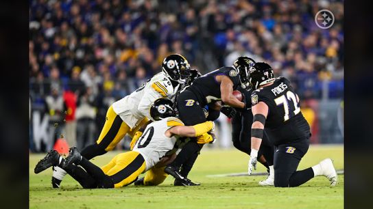 Pittsburgh Steelers DE DeMarvin Leal and OLB T.J. Watt combine to make a tackle in a 16-13 win vs The Baltimore Ravens. / Pittsburgh Steelers DE DeMarvin Leal and OLB T.J. Watt combine to make a tackle in a 16-13 win vs The Baltimore Ravens. /
