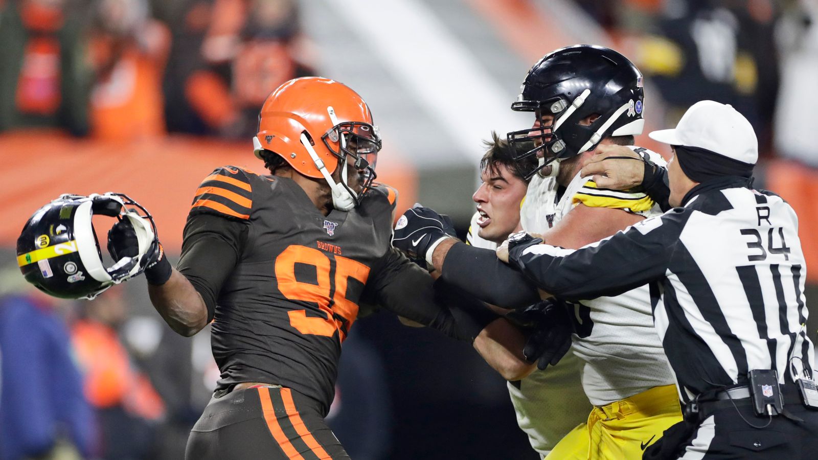 Myles Garrett Delivers Bizarre Statement On His Relationship With Steelers' Mason Rudolph (Steelers News). Photo by Ron Schwane / AP Photo