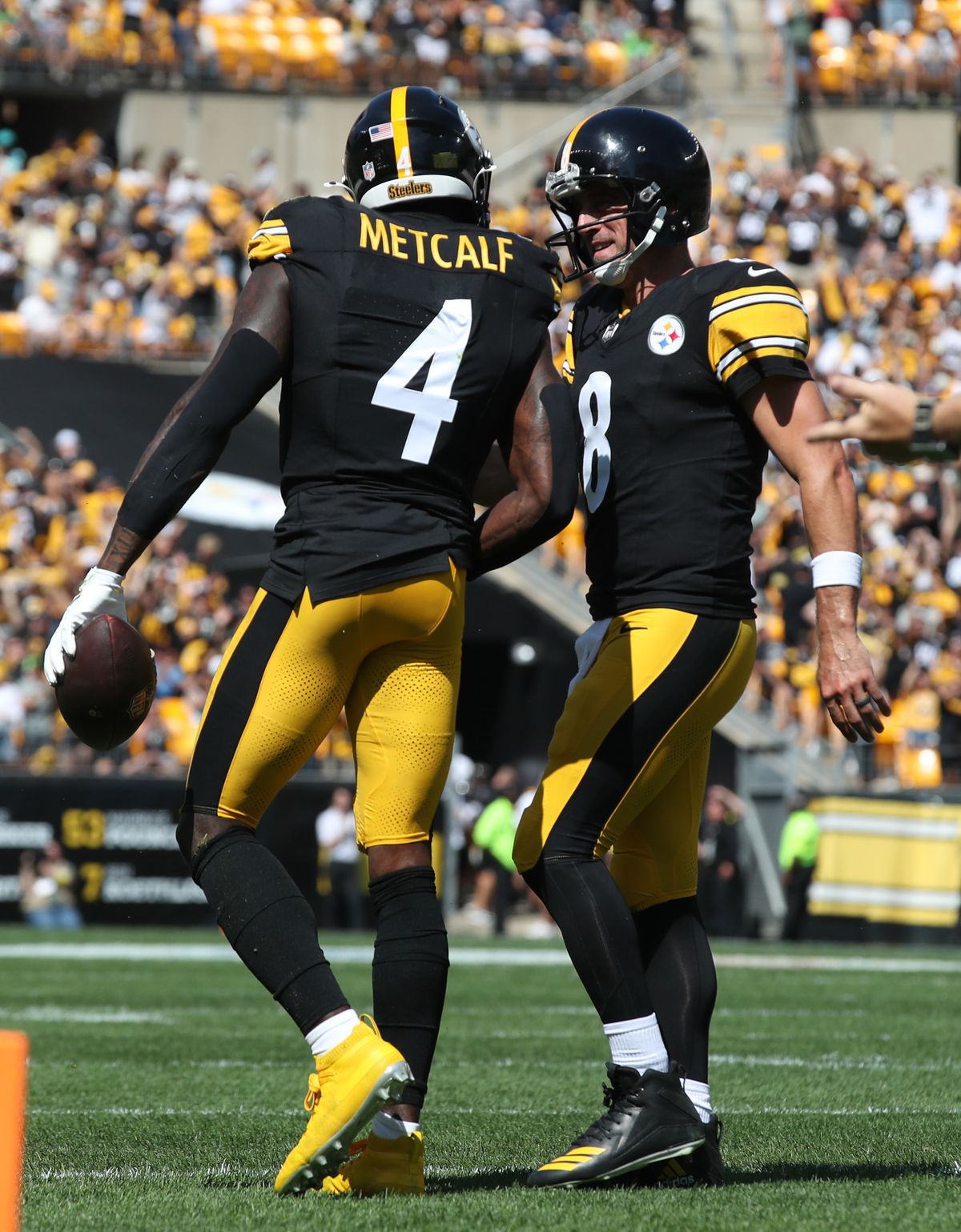 Pittsburgh Steelers wide receiver DK Metcalf (4) and quarterback Aaron Rodgers (8) celebrate after combining for a touchdown against the Seattle Seahawks during the second quarter at Acrisure Stadium. Pittsburgh Steelers wide receiver DK Metcalf (4) and quarterback Aaron Rodgers (8) celebrate after combining for a touchdown against the Seattle Seahawks during the second quarter at Acrisure Stadium.