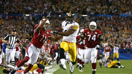 James Harrison of the Pittsburgh Steelers scores a touchdown after running back an interception for 100 yards against the Arizona Cardinals in Super Bowl XLIII. 