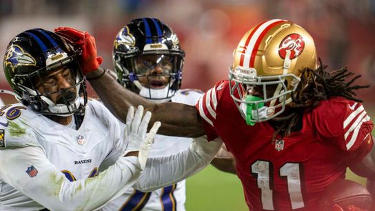 49ers' Brandon Aiyuk stiff arming a Ravens player. Steelers Brandon Aiyuk