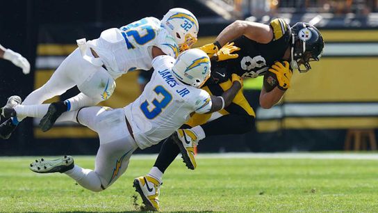 Steelers' Pat Freiermuth gets hit by Chargers' Derwin James. Steelers' Pat Freiermuth