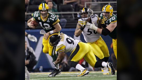 Green Bay Packers' Aaron Rodgers (12) is sacked by Pittsburgh Steelers' James Harrison (92) Green Bay Packers' Aaron Rodgers (12) is sacked by Pittsburgh Steelers' James Harrison (92)