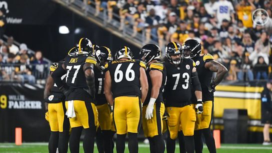 The Pittsburgh Steelers' starting offense in a huddle before a play during a Week 5 Cowboys game at home in 2024.