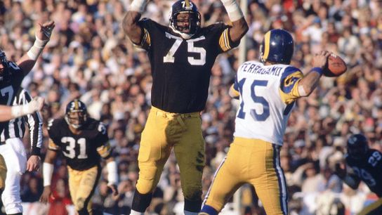 Pittsburgh Steelers defensive tackle ”Mean Joe Greene” blocks a pass attempt by Los Angeles Rams quarterback Vince Ferragamo during Super Bowl XIV on Jan. 20, 1980 at the Rose Bowl in Pasadena, Calif.