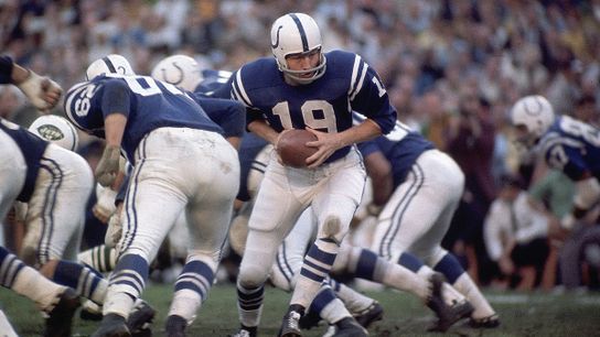 Baltimore Colts' QB Johnny Unitas turns with the football during a game. Steelers' Johnny Unitas