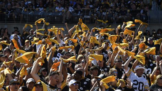Steelers' fans waving their Terrible Towels while celebrating during a home game at Acrisure Stadium. Steelers' fans waving their Terrible Towels while celebrating during a home game at Acrisure Stadium.